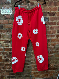 Red denim tears pants