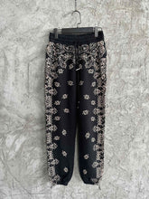 Load image into Gallery viewer, Amiri black paisely print joggers
