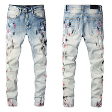 Load image into Gallery viewer, Amiri black and red paint stroke denim
