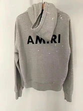 Load image into Gallery viewer, Amiri splatter paint hoodie gray
