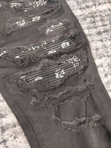 Black paisley patted denim